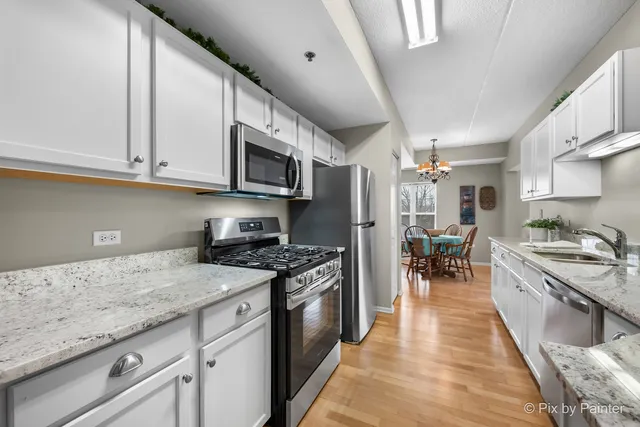a living room with furniture a couch and a flat screen tv