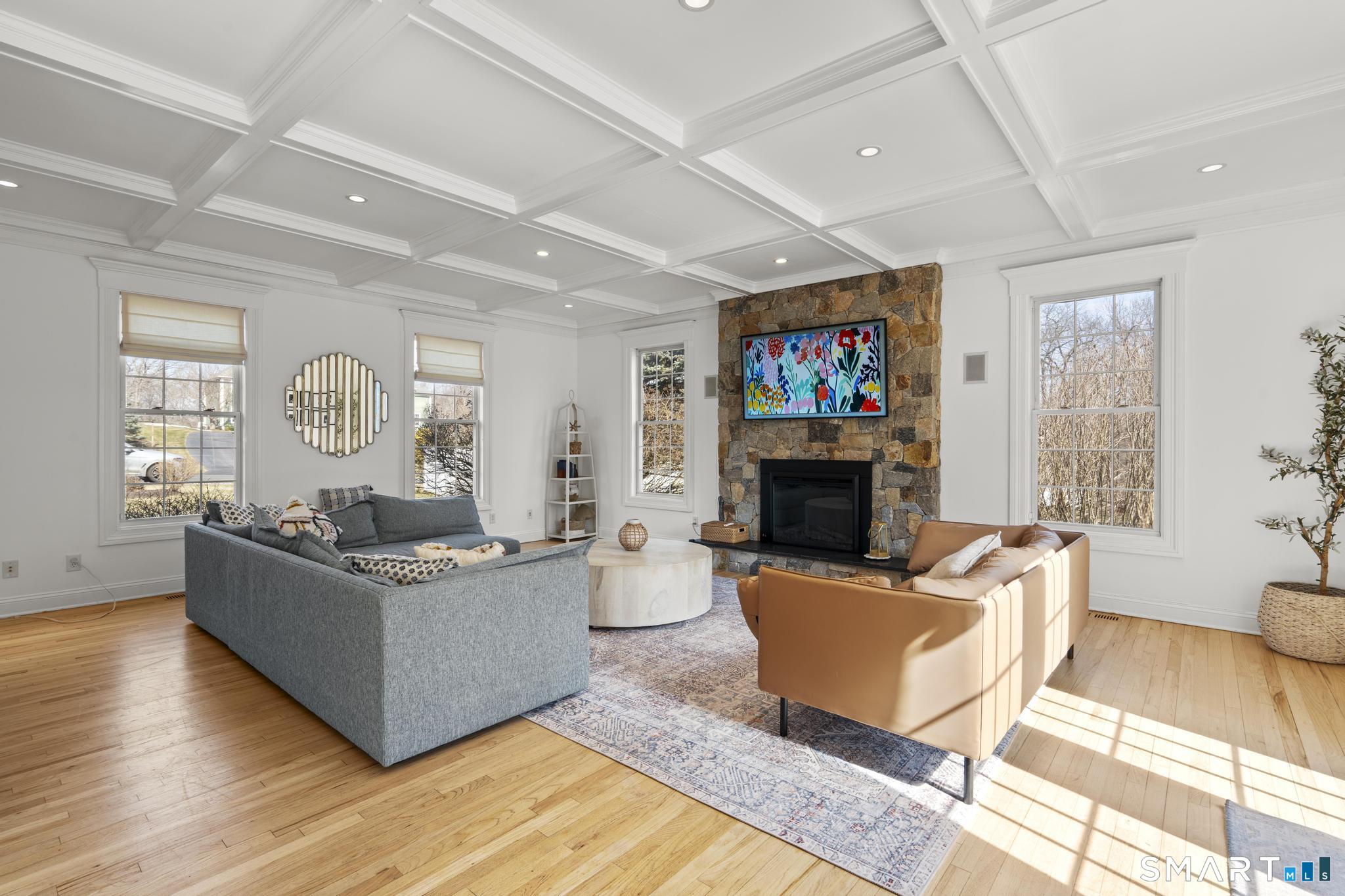 23 Country Lane Bethany, CT 06524 - Photo 11 of 31 large family room with stone fireplace and coffered ceilings