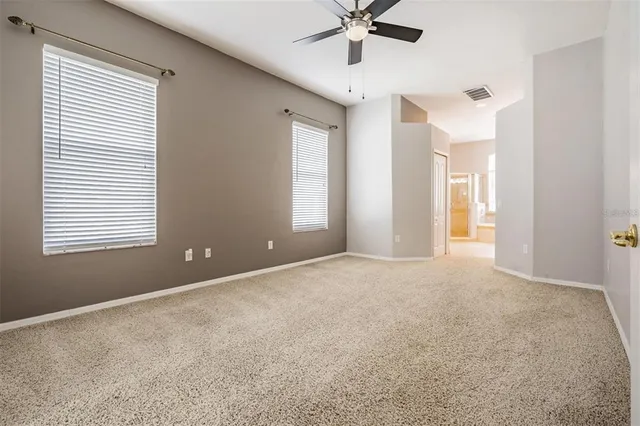 a bathroom with a granite countertop sink mirror and shower