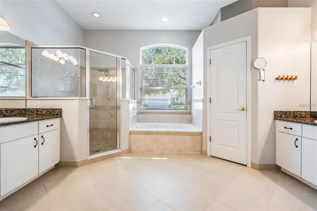 a kitchen with a sink refrigerator and microwave