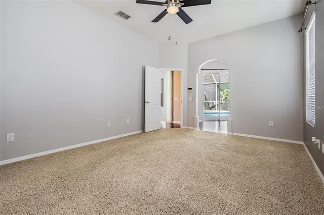 a kitchen with granite countertop a refrigerator a stove top oven a sink and dishwasher