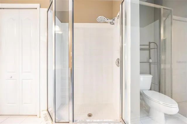 an aerial view of a house with a yard and lake view