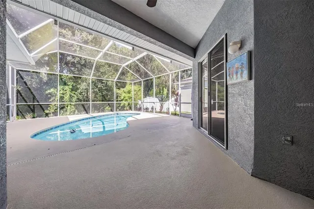 a view of a swimming pool with an outdoor space