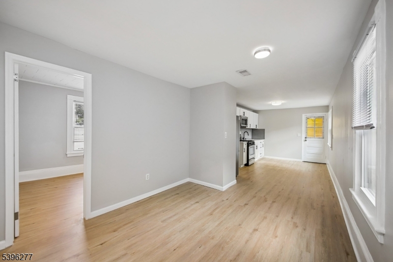 176 Valley Street, Unit 2 South Orange, NJ 07079 - Photo 18 of 30 a view of a big room with wooden floor and windows