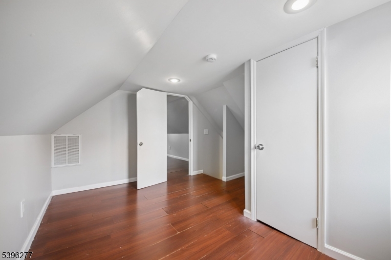 176 Valley Street, Unit 2 South Orange, NJ 07079 - Photo 21 of 30 a view of a big room with wooden floor and windows