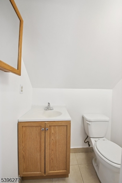 176 Valley Street, Unit 2 South Orange, NJ 07079 - Photo 26 of 30 a bathroom with a toilet a sink and mirror
