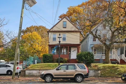 a car parked in front of a house