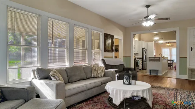 a living room with furniture and a large window
