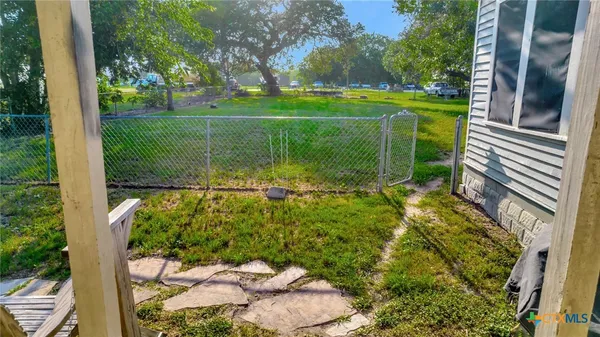 a view of a golf club with a backyard