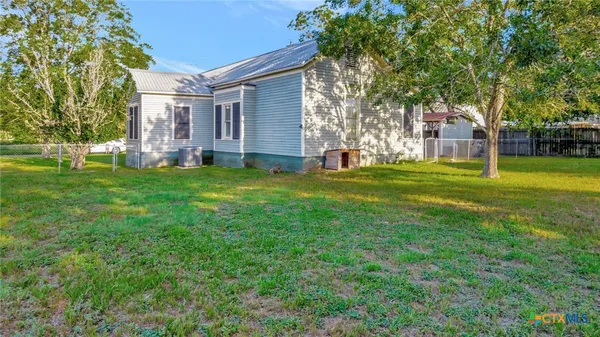 a view of a house with a big yard