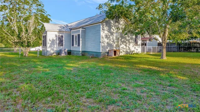 a view of a house with a big yard