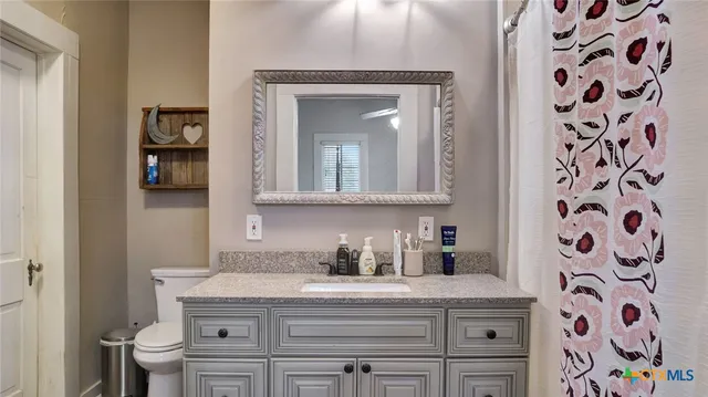 a room with a sink and a mirror