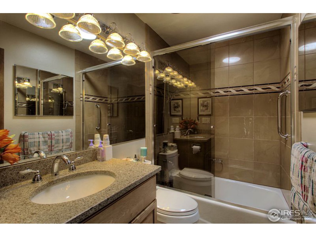 5725 Olde Stage Road Boulder, CO 80302 - Photo 14 of 25 a bathroom with a sink a toilet and shower