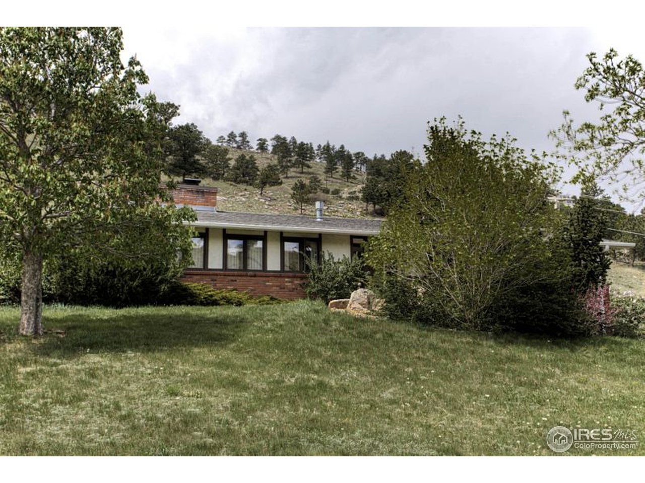 5725 Olde Stage Road Boulder, CO 80302 - Photo 2 of 25 a view of a house with a yard