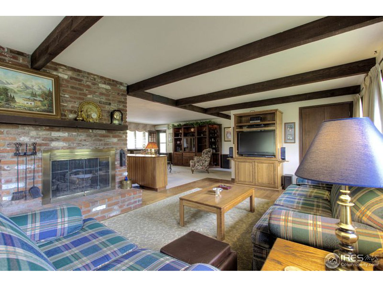 5725 Olde Stage Road Boulder, CO 80302 - Photo 4 of 25 a living room with furniture and a fireplace