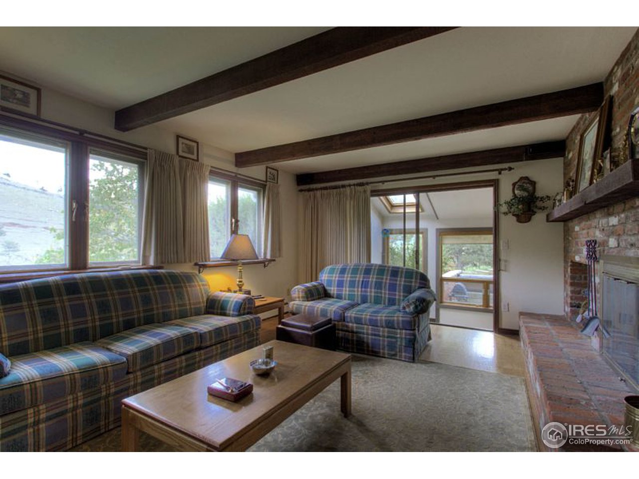 5725 Olde Stage Road Boulder, CO 80302 - Photo 5 of 25 a living room with furniture and a window