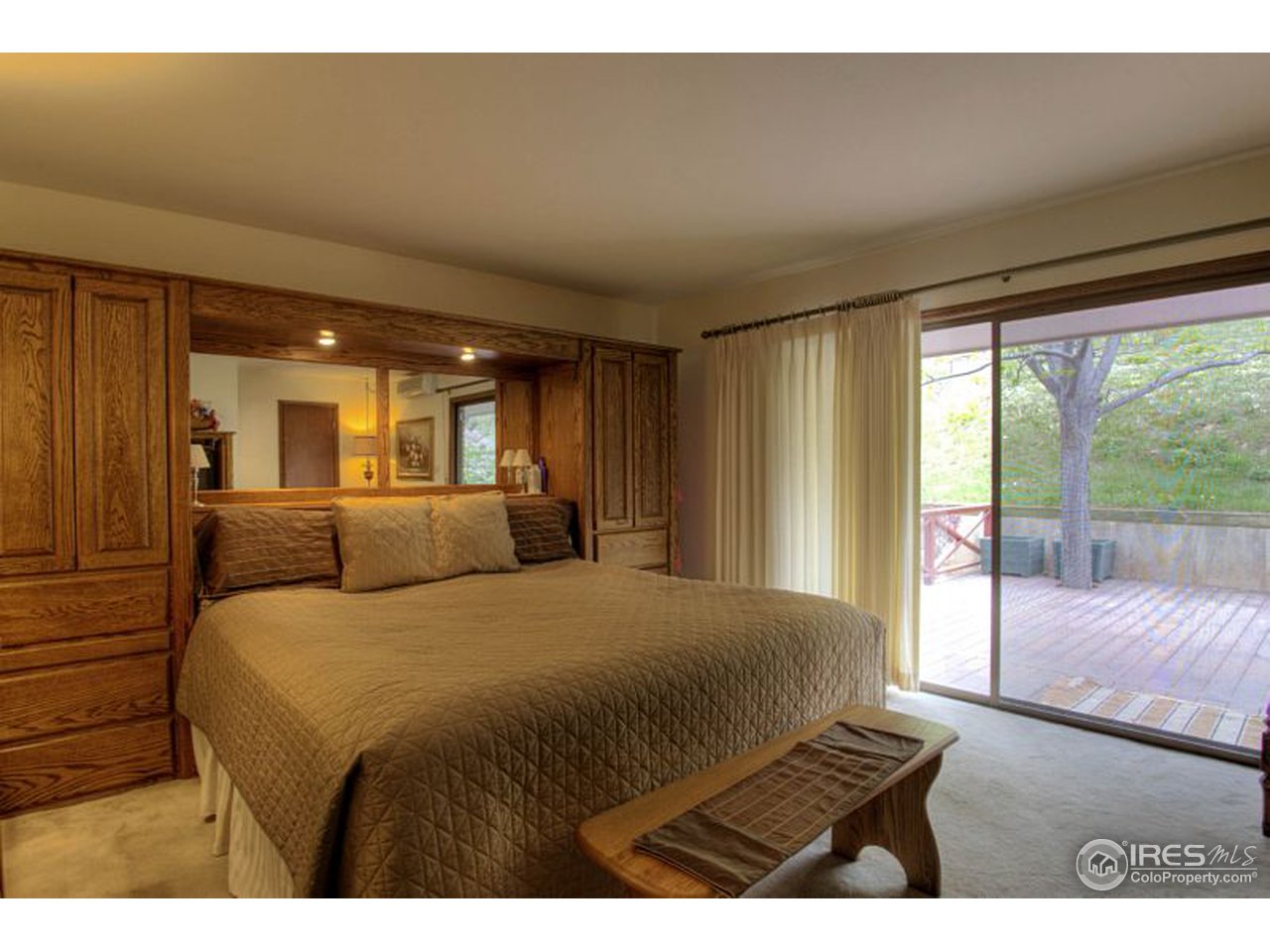 5725 Olde Stage Road Boulder, CO 80302 - Photo 10 of 25 a bedroom with a large bed and a large window