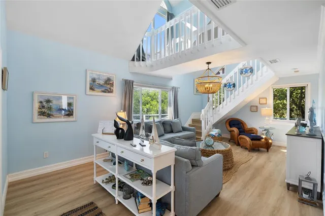 a kitchen with stainless steel appliances kitchen island granite countertop a sink a stove and a refrigerator