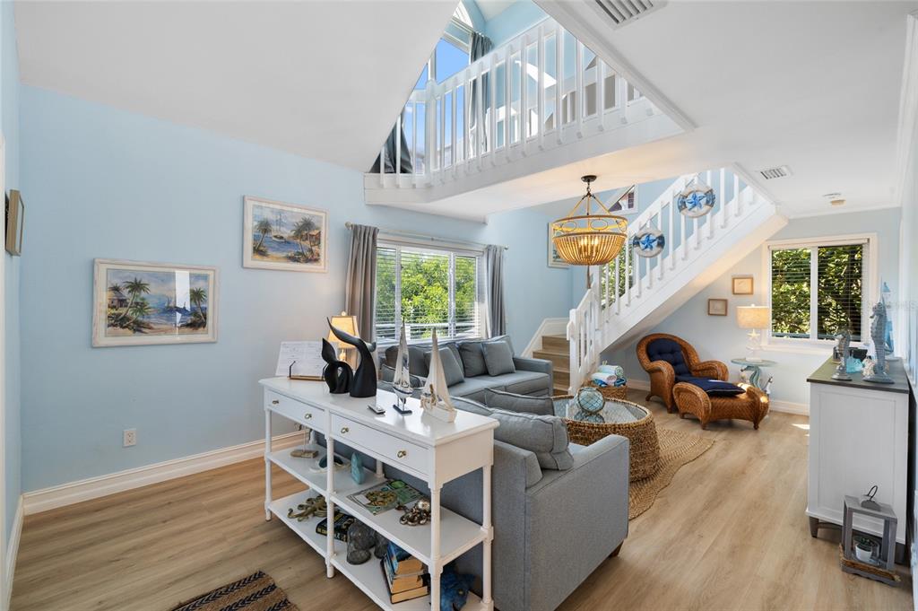 9368 Little Gasparilla Placida, FL 33946 - Photo 14 of 51 a living room with furniture and a chandelier