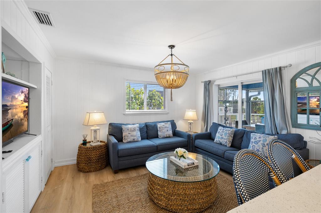 9368 Little Gasparilla Placida, FL 33946 - Photo 18 of 51 a living room with furniture a rug and a flat screen tv