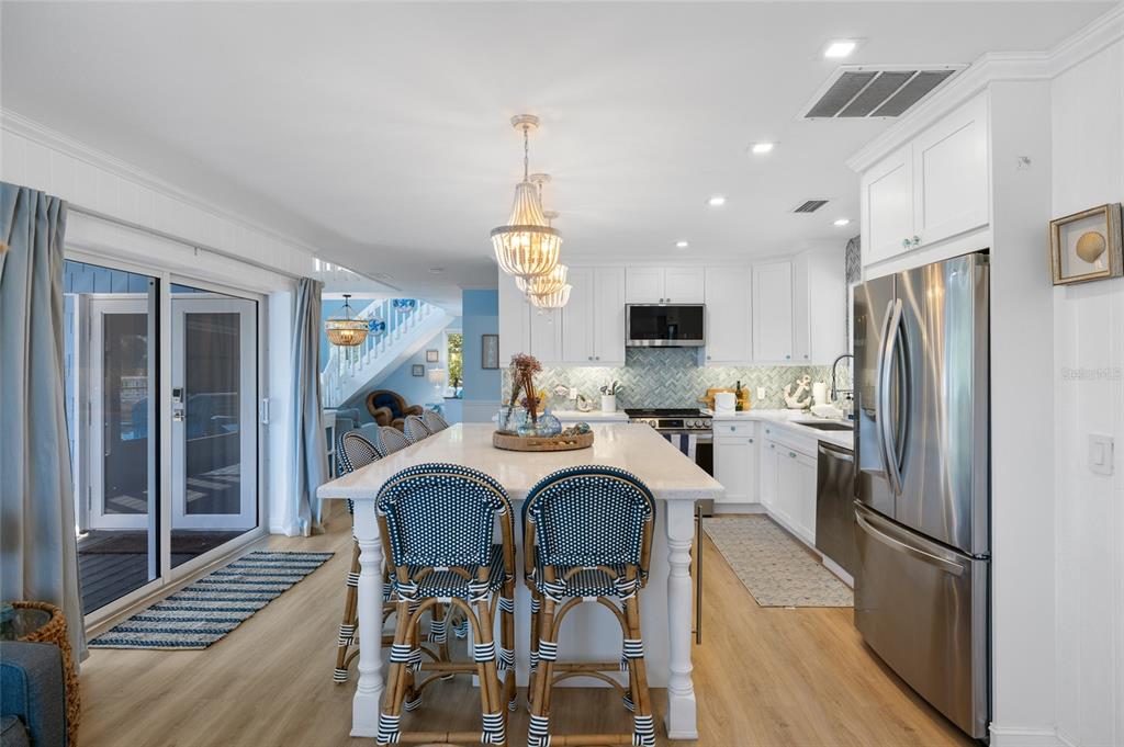 9368 Little Gasparilla Placida, FL 33946 - Photo 19 of 51 a view of kitchen with sink refrigerator and microwave