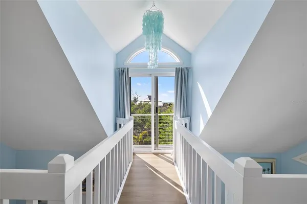 a view of entryway livingroom and hall with wooden floor