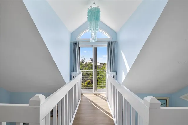 a view of entryway livingroom and hall with wooden floor