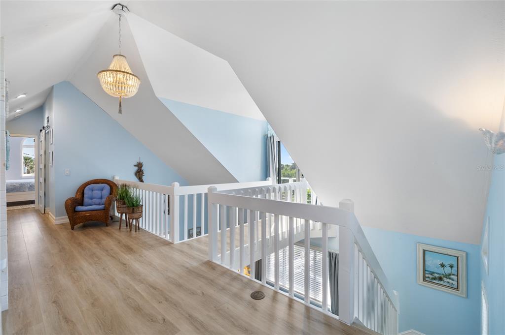 9368 Little Gasparilla Placida, FL 33946 - Photo 27 of 51 a view of entryway livingroom and hall with wooden floor