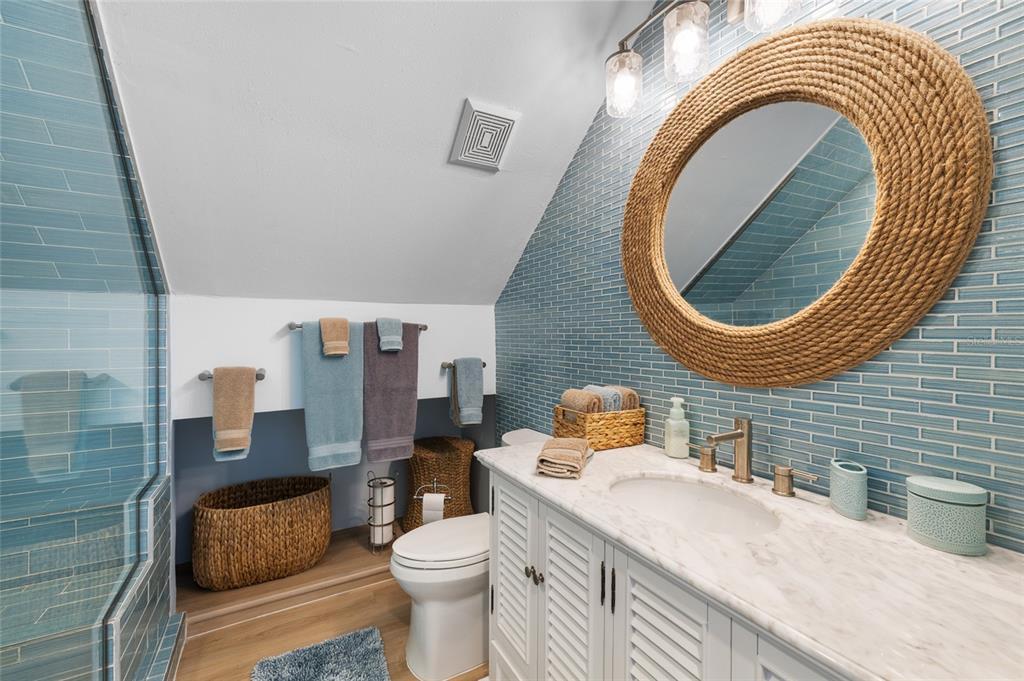 9368 Little Gasparilla Placida, FL 33946 - Photo 30 of 51 a bathroom with a sink and a mirror