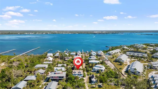 a view of a lake with outdoor seating