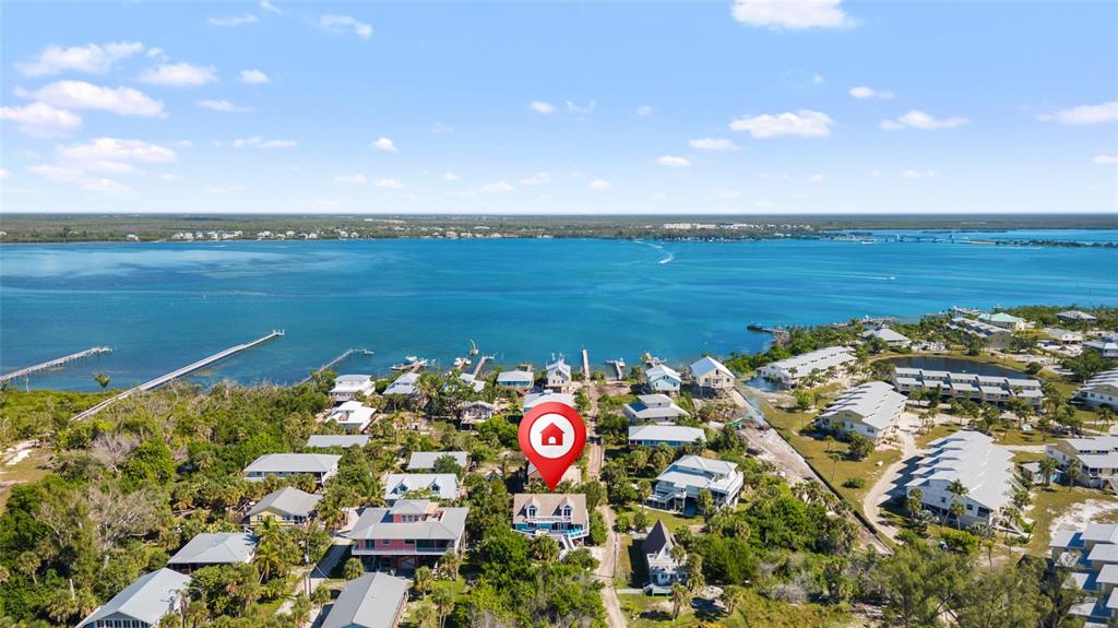 9368 Little Gasparilla Placida, FL 33946 - Photo 45 of 51 a view of outside area with floor to ceiling window and outdoor space