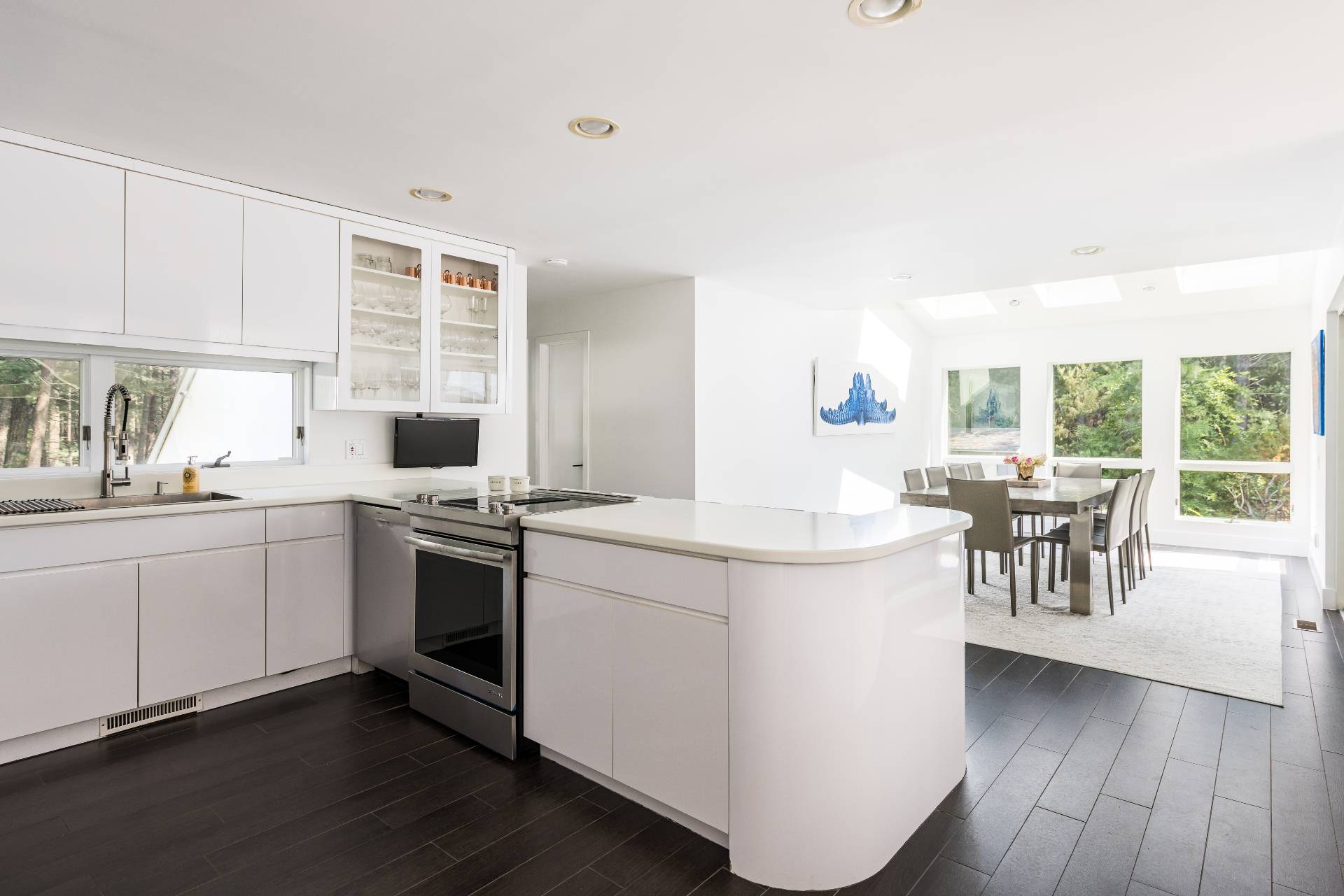 52 Bull Path East Hampton, NY 11937 - Photo 8 of 24 a kitchen with a stove and cabinets