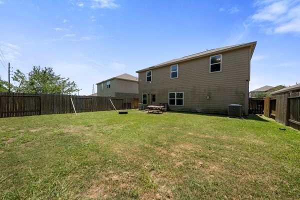 1327 Diamond Drape Drive Rosharon, TX 77583 - Photo 23 of 26 a backyard of a house with table and chairs