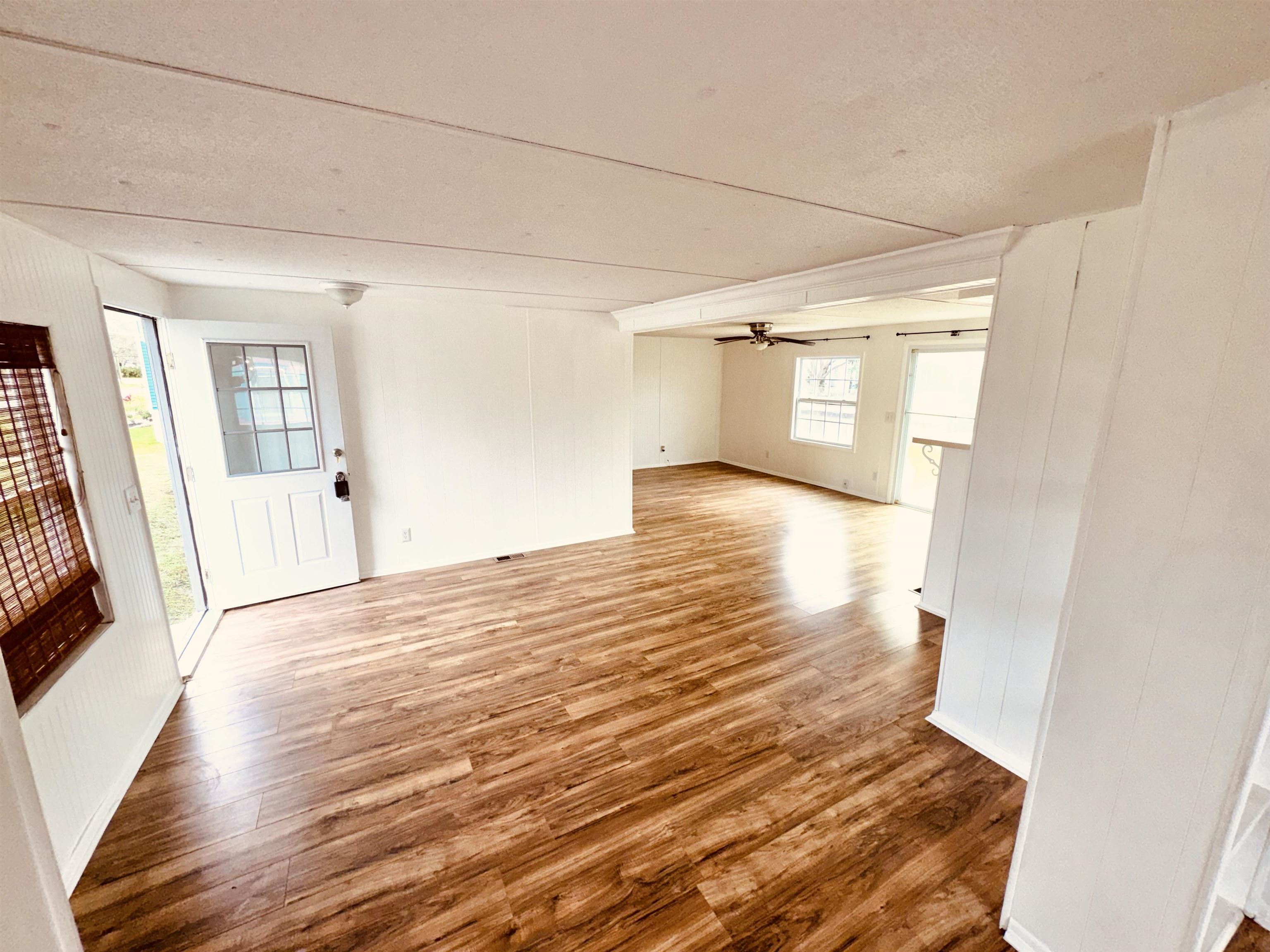 267 Basque Road St. Augustine, FL 32080 - Photo 11 of 20 a view of empty room with wooden floor and fan