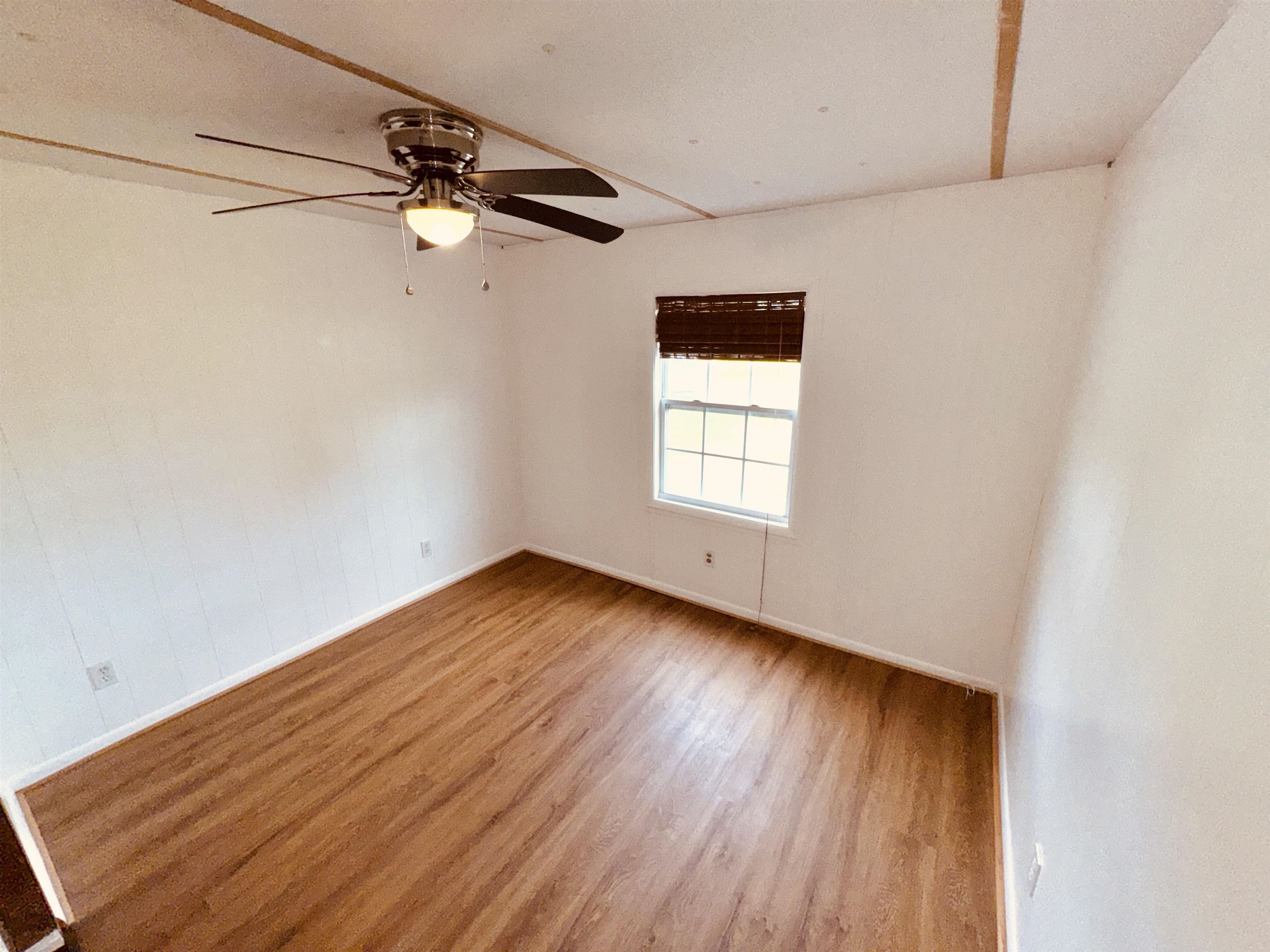 267 Basque Road St. Augustine, FL 32080 - Photo 13 of 20 a view of empty room with wooden floor and fan