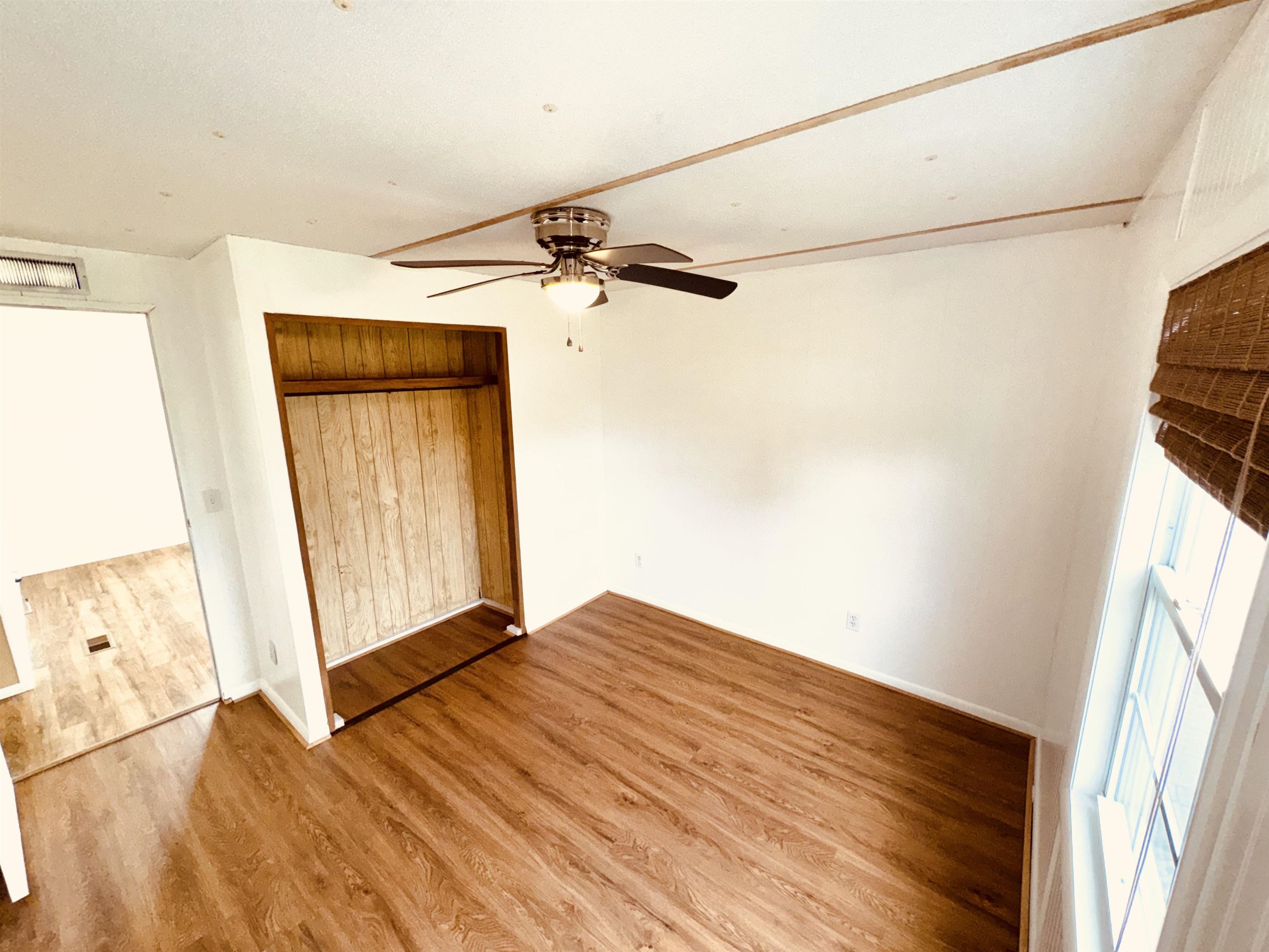 267 Basque Road St. Augustine, FL 32080 - Photo 14 of 20 a view of empty room with wooden floor and fan