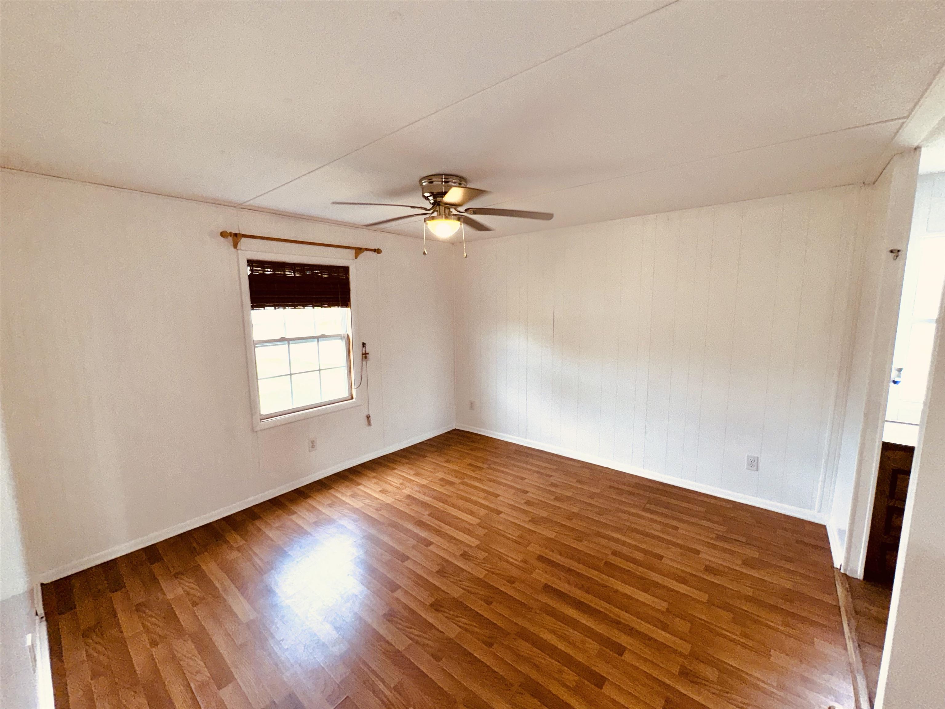 267 Basque Road St. Augustine, FL 32080 - Photo 18 of 20 wooden floor in an empty room with a window