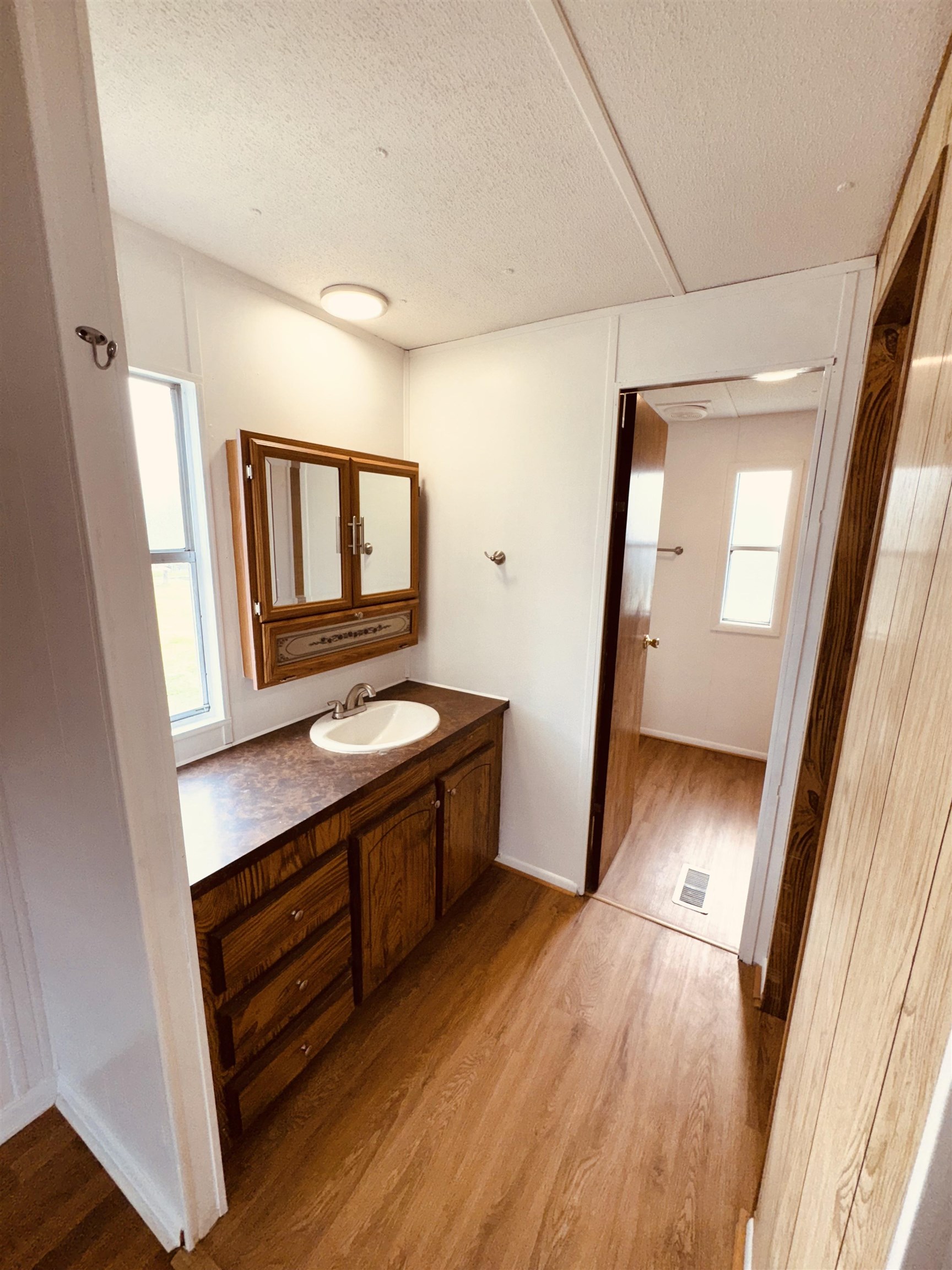 267 Basque Road St. Augustine, FL 32080 - Photo 4 of 20 a view of hallway with a mirror and a sink