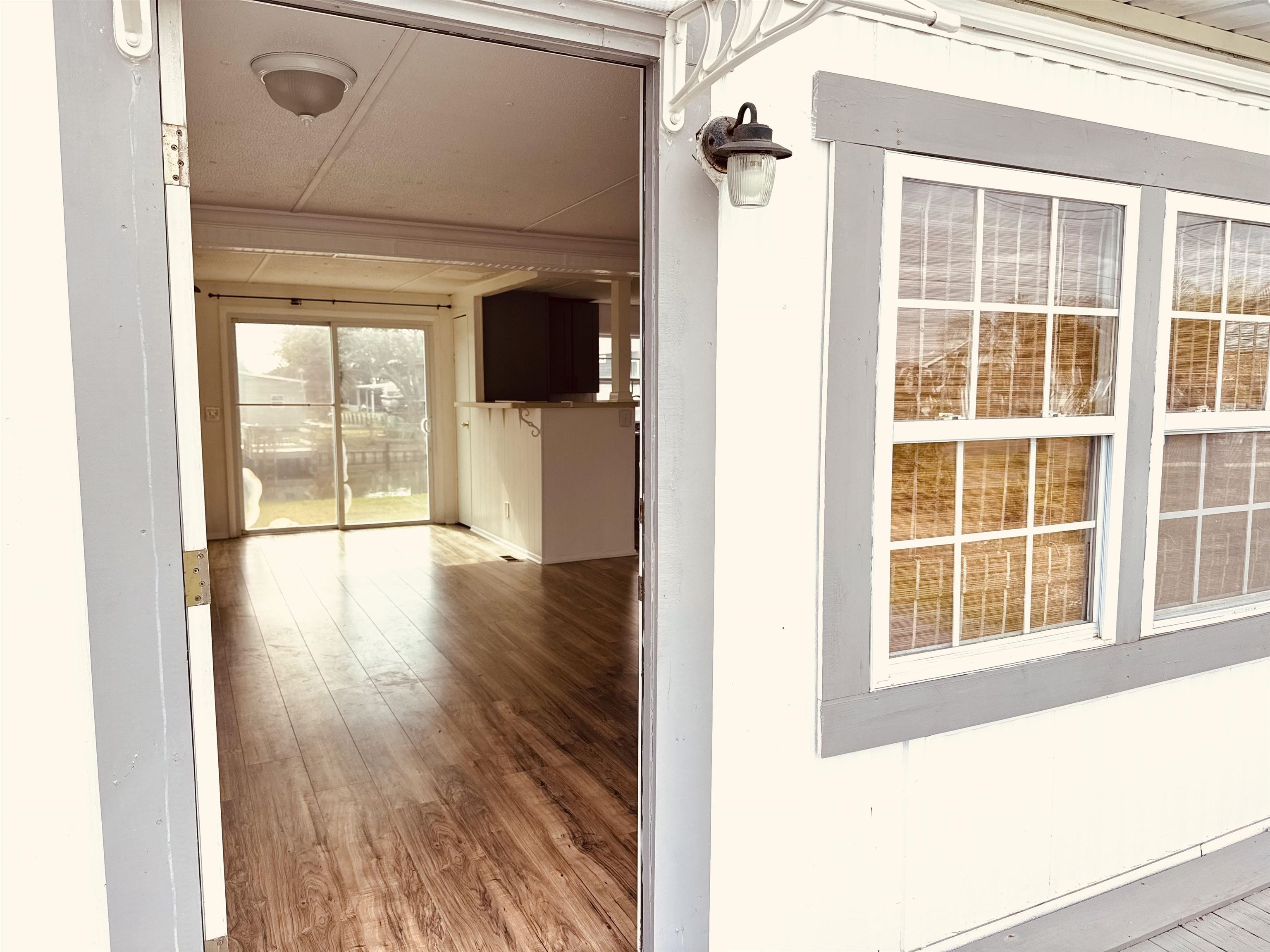267 Basque Road St. Augustine, FL 32080 - Photo 6 of 20 a view of an entryway with wooden floor