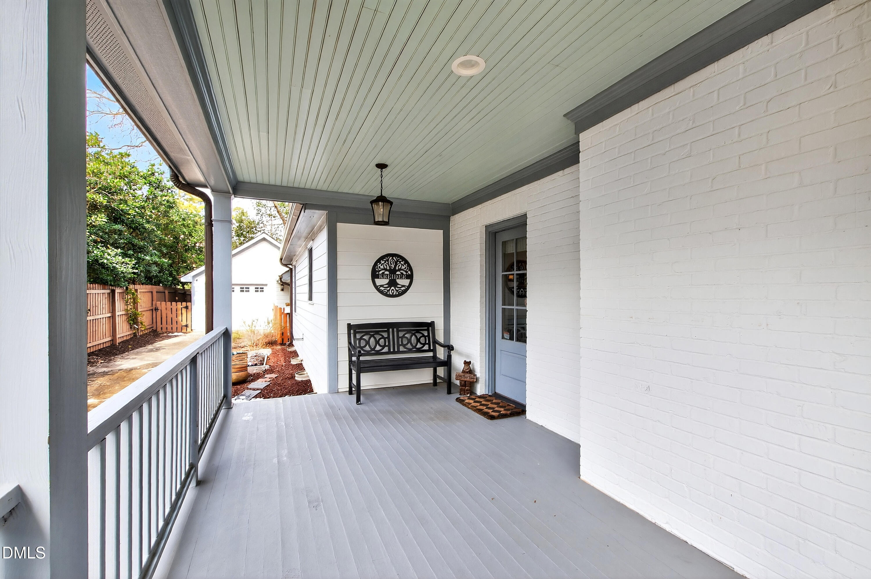 2622 Wells Avenue Raleigh, NC 27608 - Photo 7 of 65 a view of a hallway with wooden floor and door