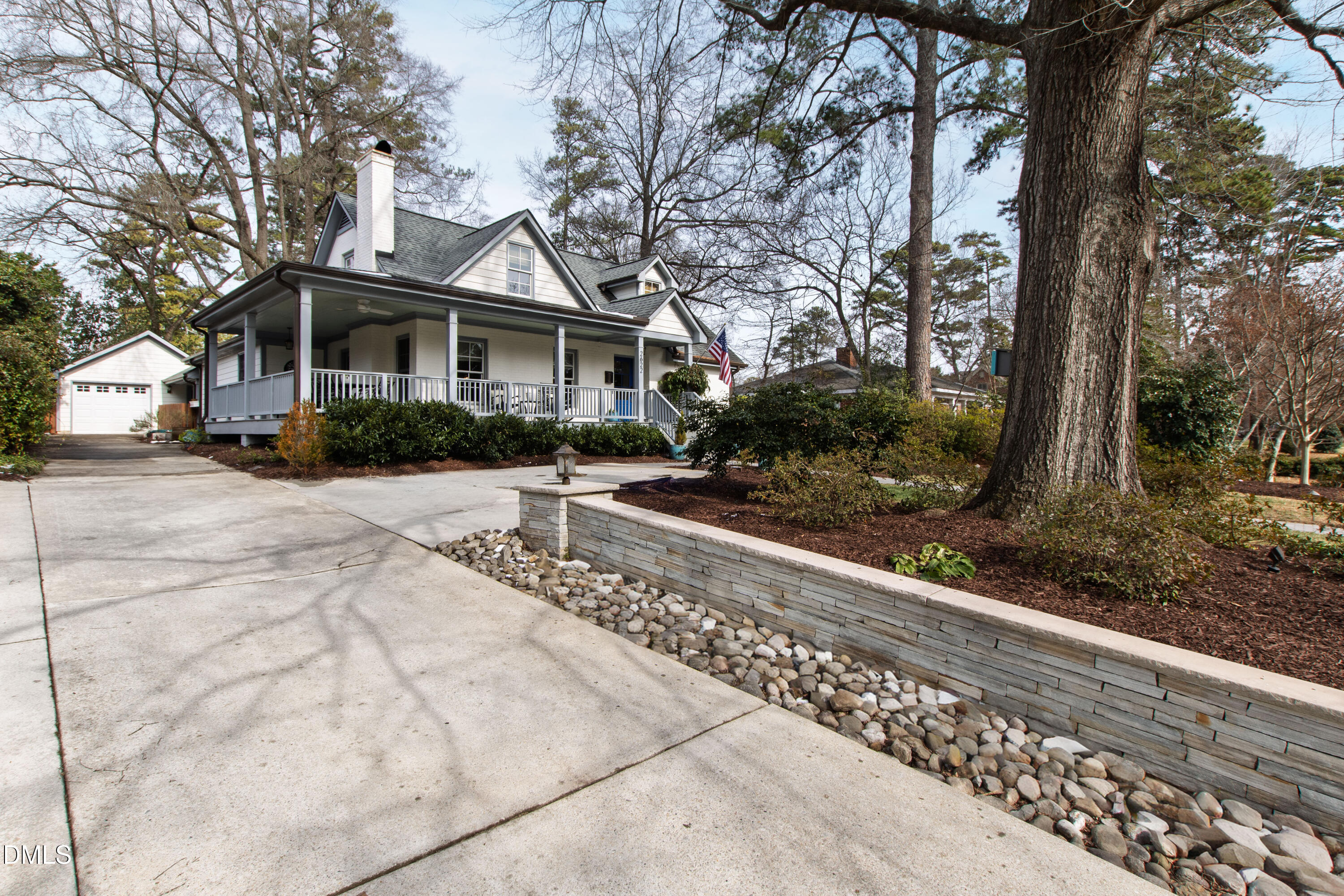 2622 Wells Avenue Raleigh, NC 27608 - Photo 8 of 65 a front view of a house with a yard and potted plants