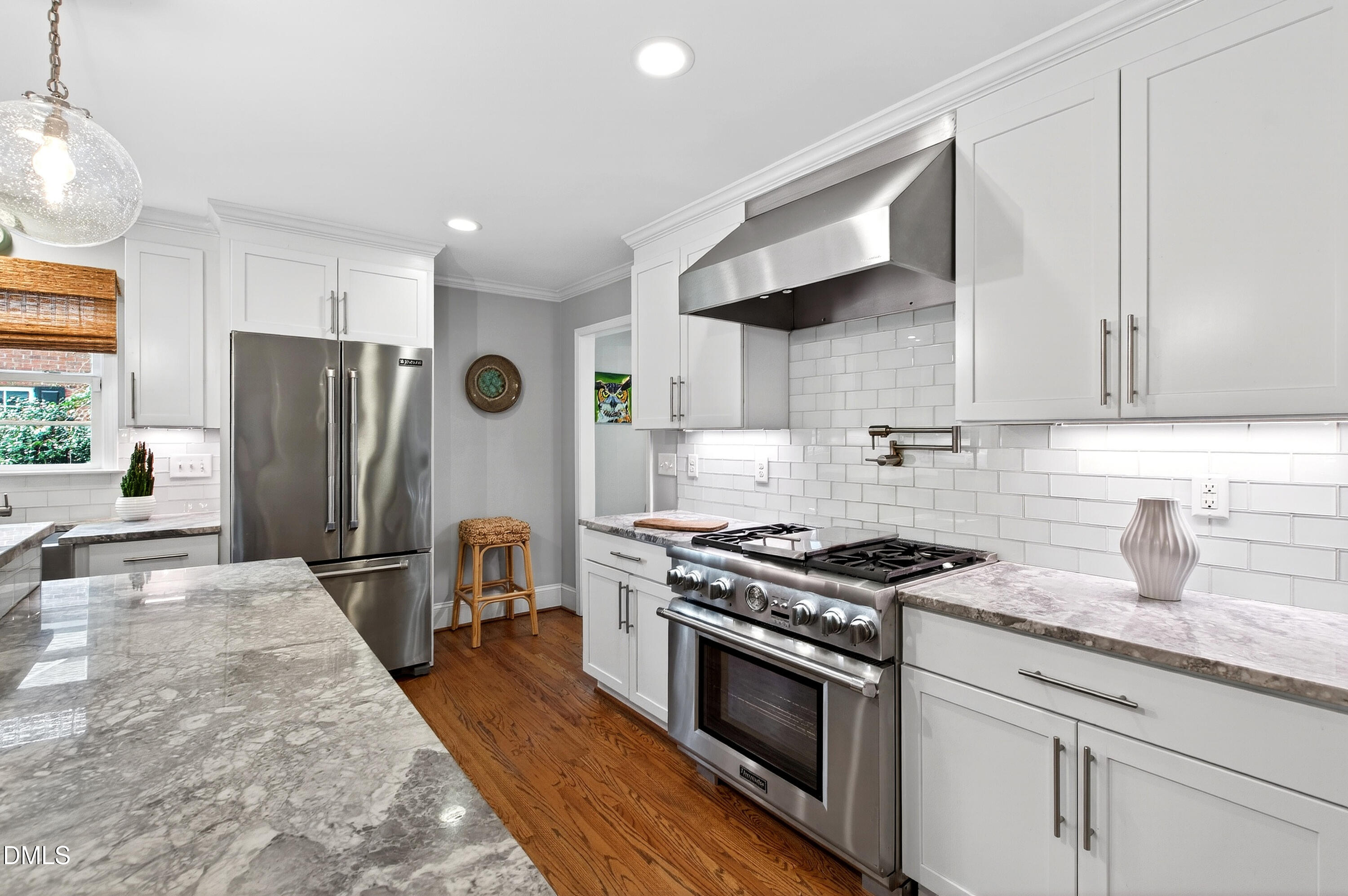 2622 Wells Avenue Raleigh, NC 27608 - Photo 24 of 65 a kitchen with stainless steel appliances granite countertop a sink stove and refrigerator