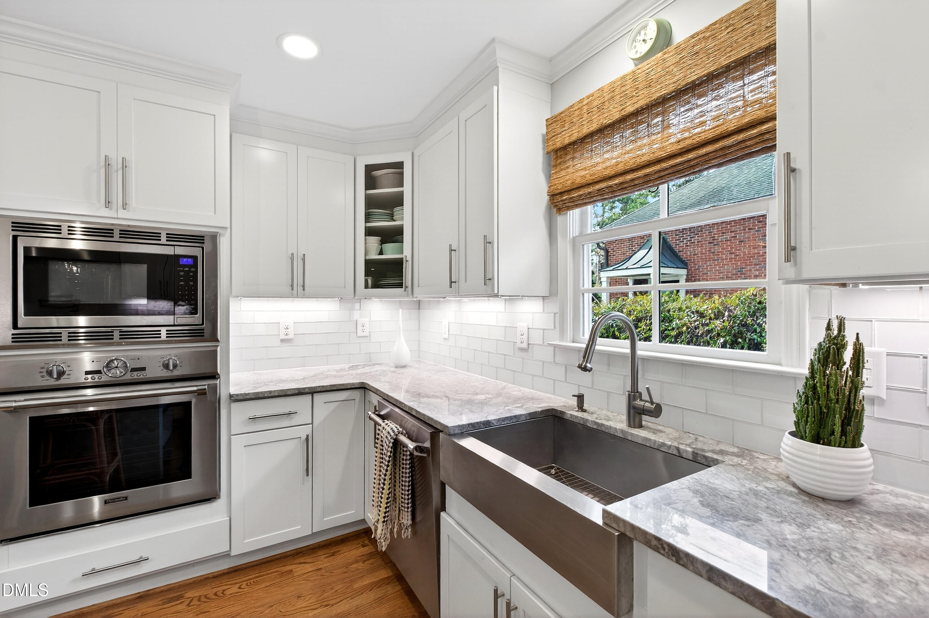 2622 Wells Avenue Raleigh, NC 27608 - Photo 26 of 65 a kitchen with granite countertop a sink stainless steel appliances and cabinets