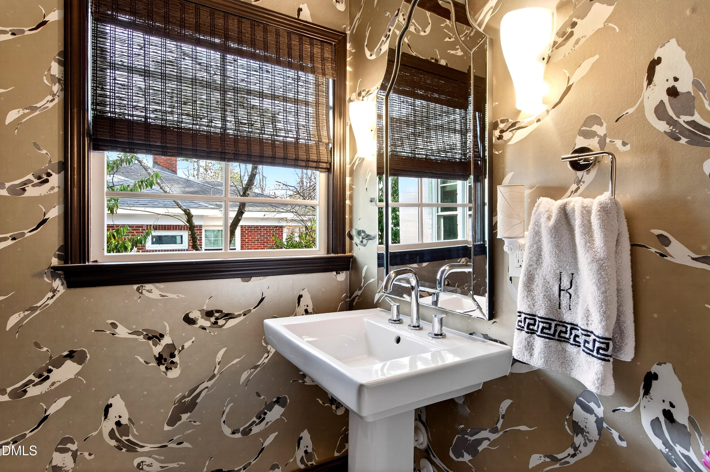2622 Wells Avenue Raleigh, NC 27608 - Photo 35 of 65 a en suite bathroom with a sink and a large mirror