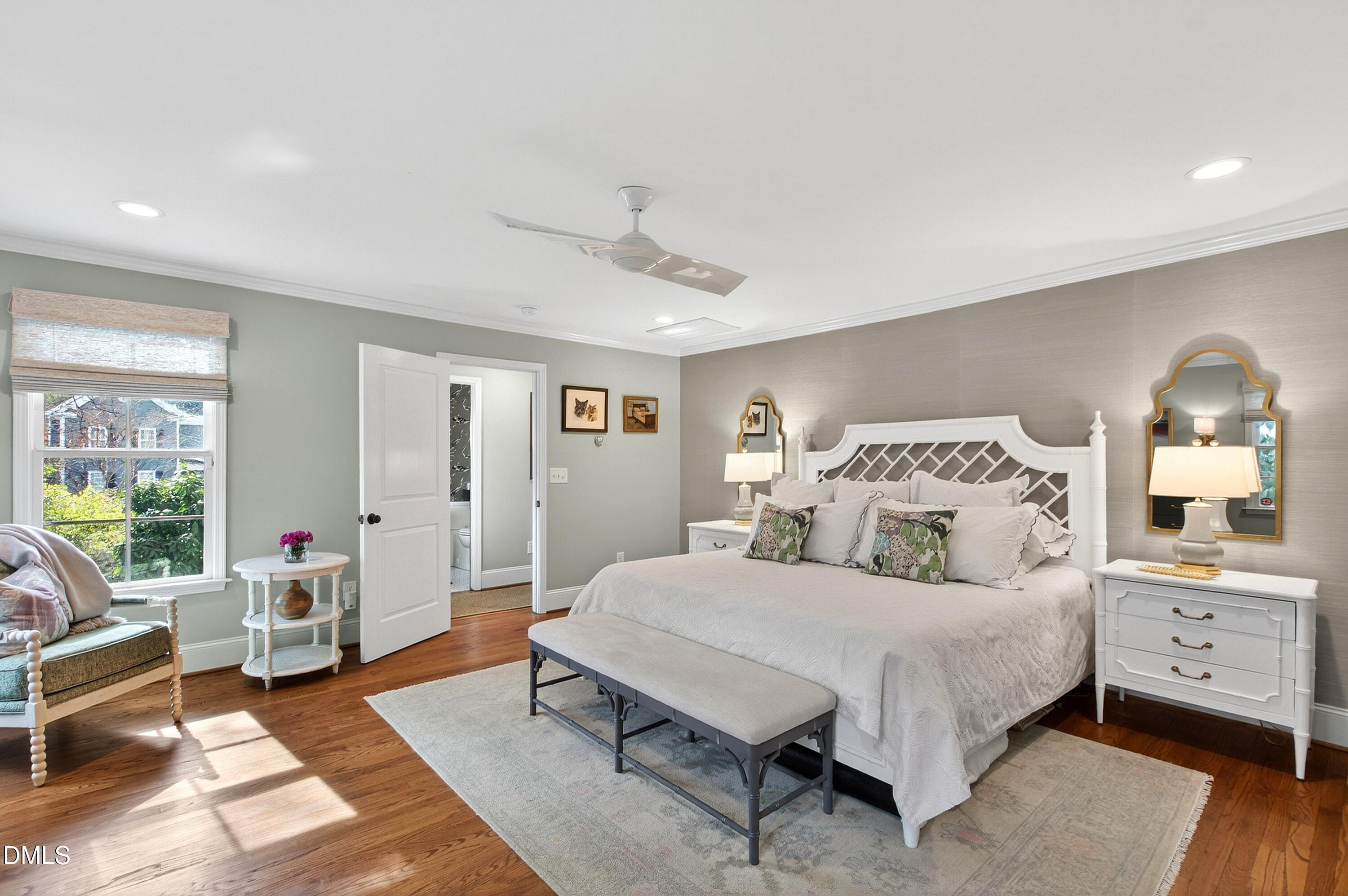 2622 Wells Avenue Raleigh, NC 27608 - Photo 36 of 65 a spacious bedroom with a bed a couch and a window