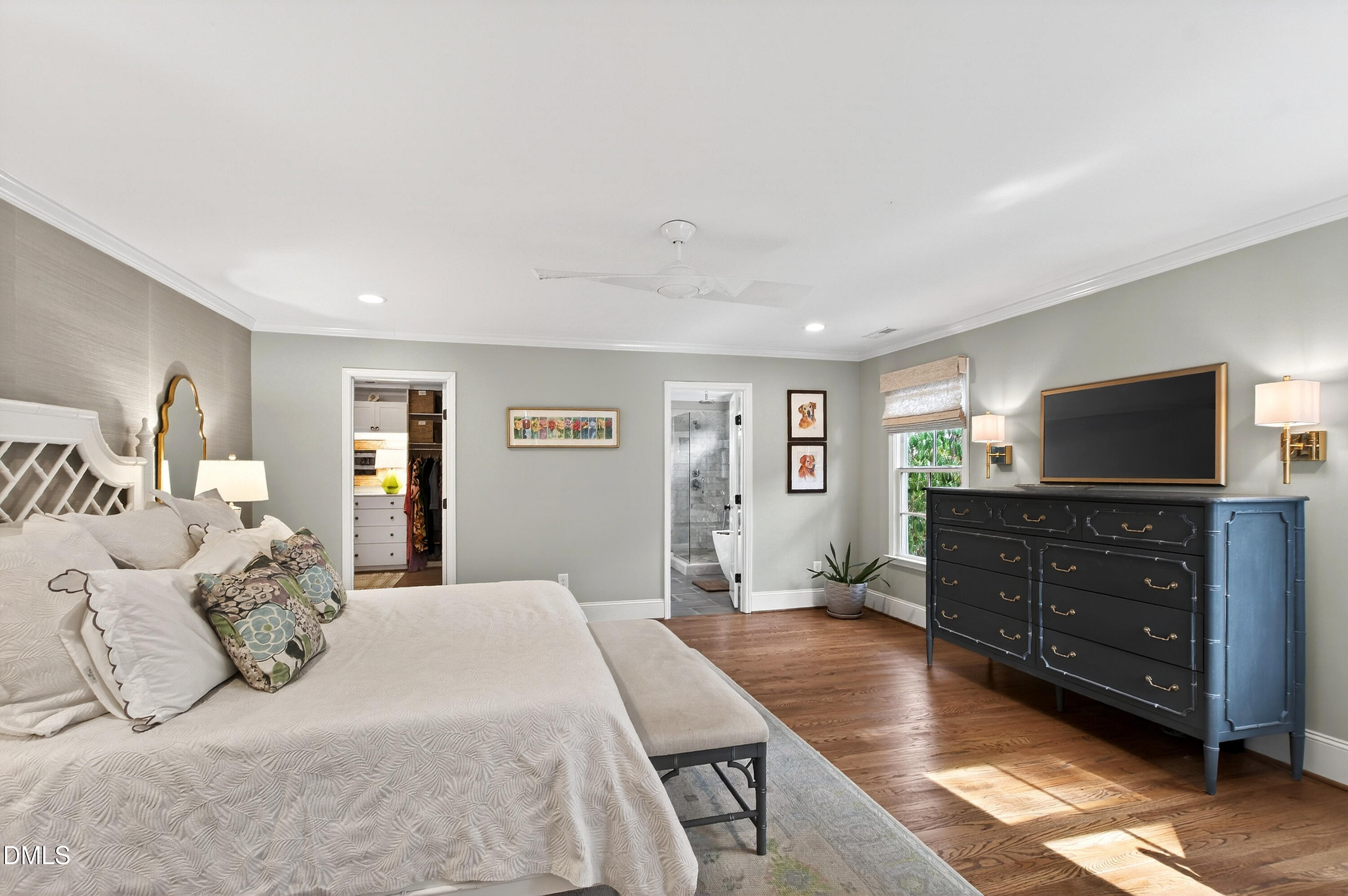 2622 Wells Avenue Raleigh, NC 27608 - Photo 37 of 65 a spacious bedroom with a bed and wooden floor