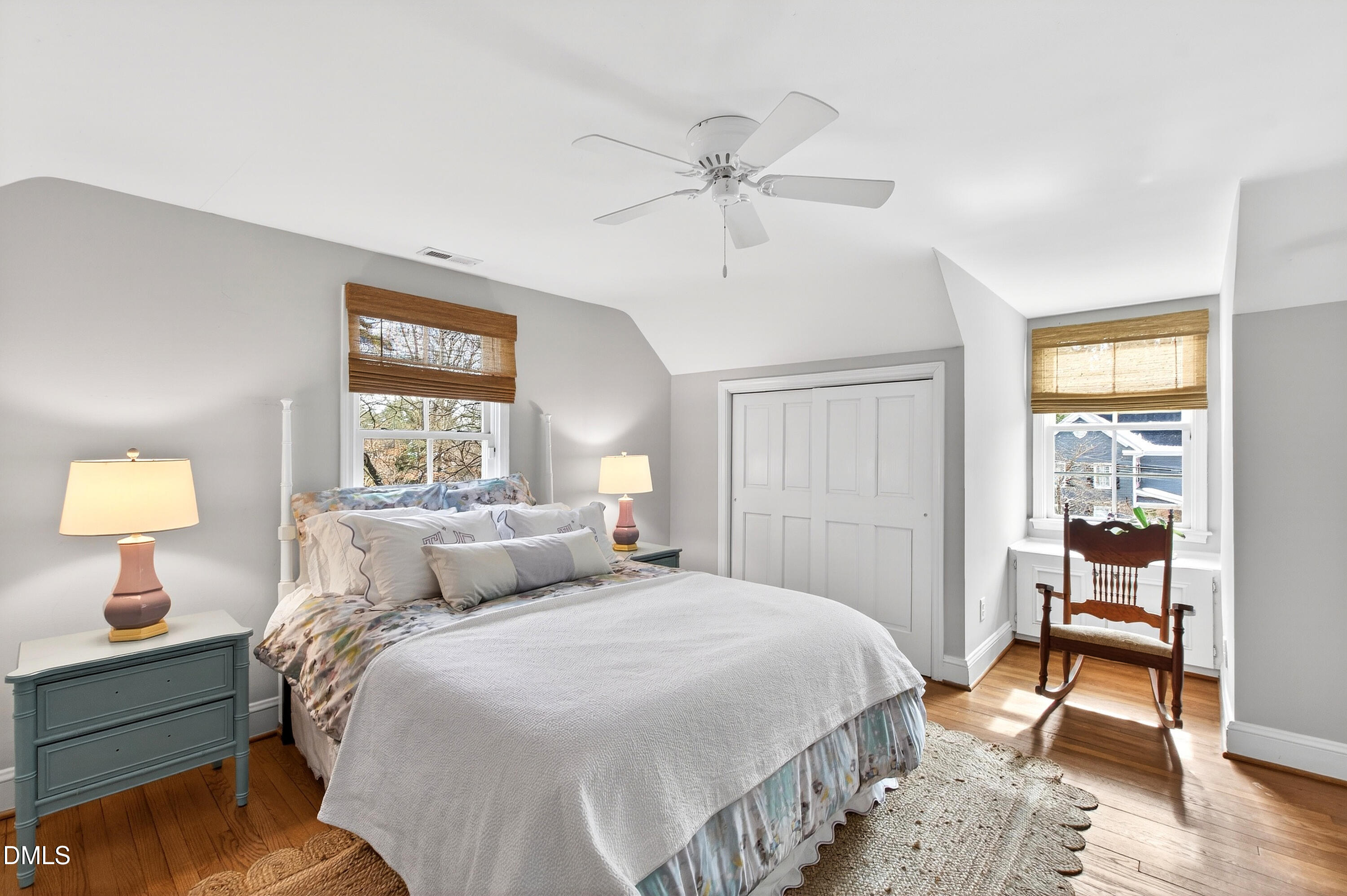 2622 Wells Avenue Raleigh, NC 27608 - Photo 44 of 65 a bedroom with a bed and a table lamp