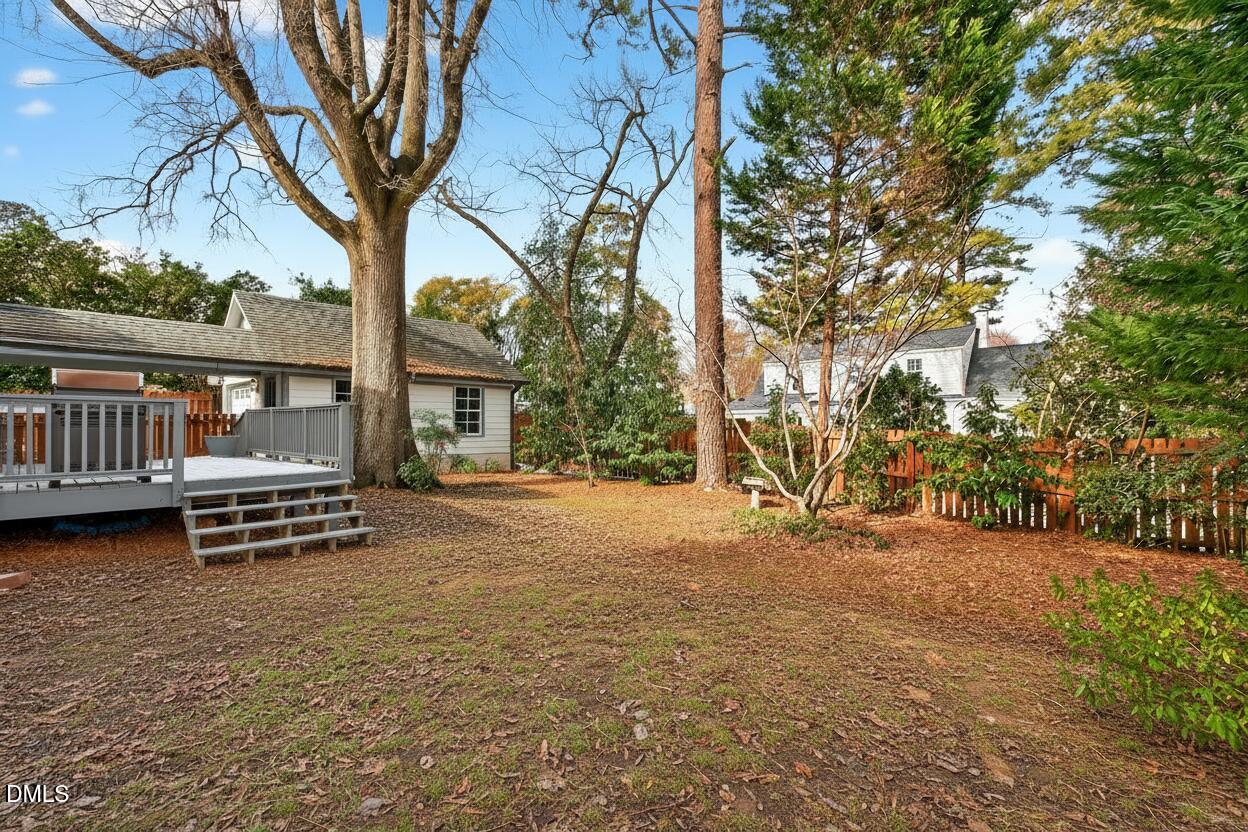 2622 Wells Avenue Raleigh, NC 27608 - Photo 61 of 65 a view of a house with backyard and a tree