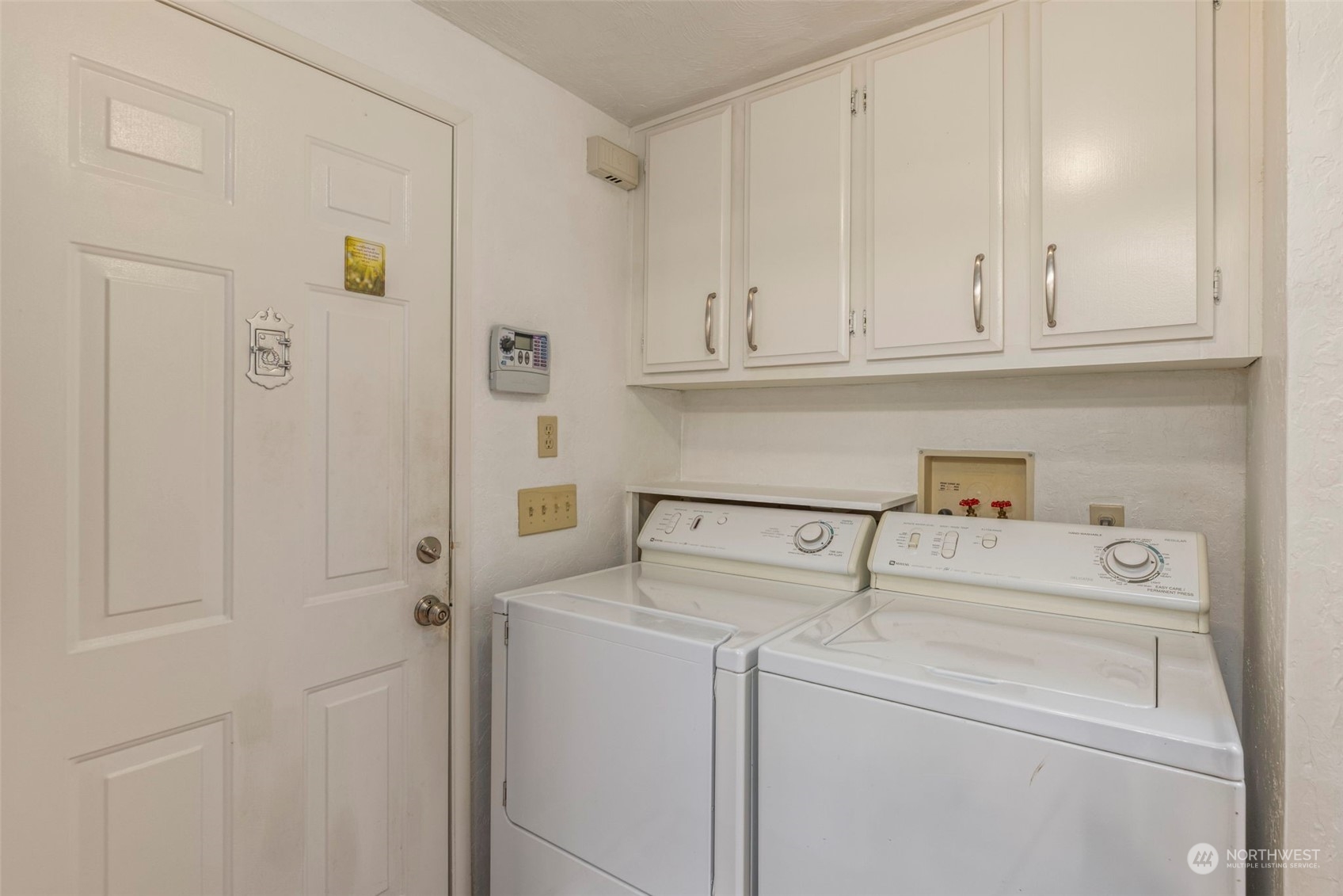919 243rd Street Southwest Bothell, WA 98021 - Photo 26 of 39 a view of storage and utility room with washer and dryer