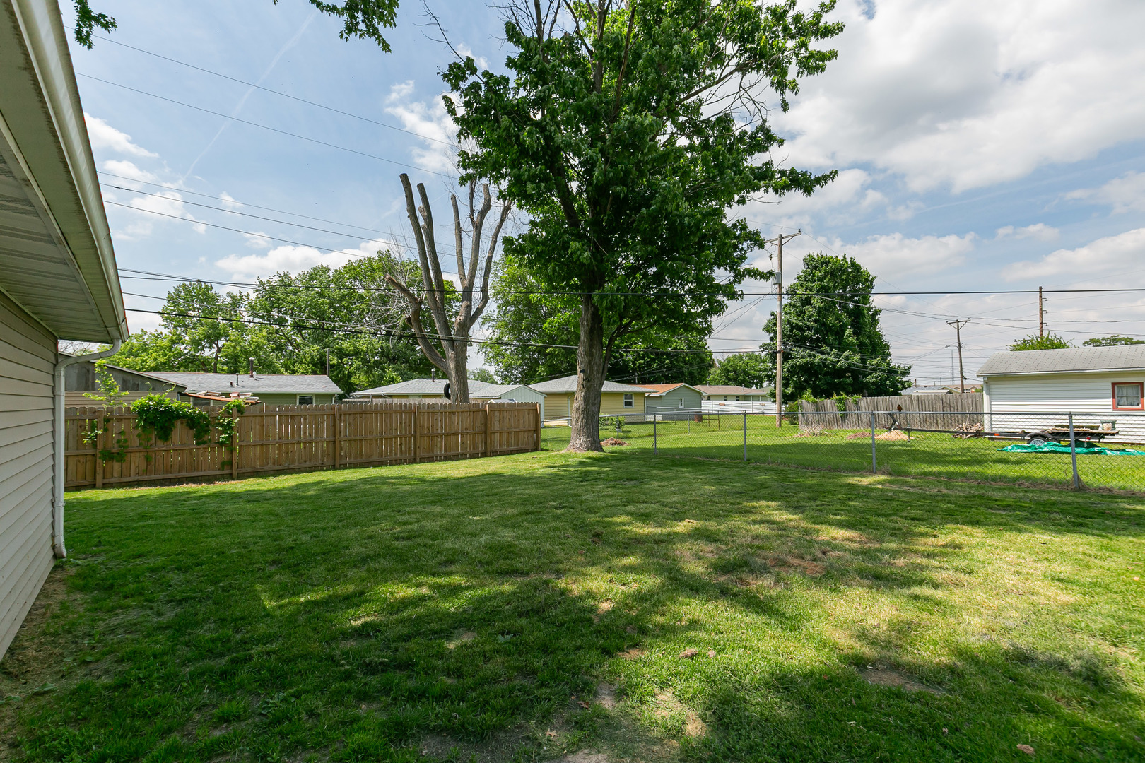 2306 9th Street Silvis, IL 61282 - Photo 7 of 32 a view of a backyard with a garden